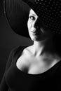 Fashion portrait of elegant woman in black and white hat Royalty Free Stock Photo