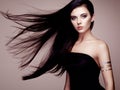 Fashion portrait of elegant woman with magnificent hair