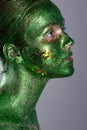 fashion portrait of girl in green vests, unusual makeup, a fabulous image