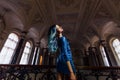 Fashion portrait of gorgeous girl with blue dyed hair long. The beautiful evening cocktail dress. Royalty Free Stock Photo