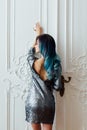 Fashion portrait of gorgeous girl with blue dyed hair long. The beautiful evening cocktail dress. Royalty Free Stock Photo