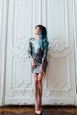 Fashion portrait of gorgeous girl with blue dyed hair long. The beautiful evening cocktail dress. Royalty Free Stock Photo