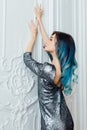 Fashion portrait of gorgeous girl with blue dyed hair long. The beautiful evening cocktail dress. Royalty Free Stock Photo