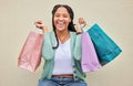 Fashion, portrait or happy African girl with shopping bag or smile in retail therapy with wall background. Freedom