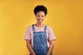 Fashion, portrait and happy black woman in studio with confidence, style and cool outfit on yellow background. Face Royalty Free Stock Photo
