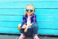 Fashion portrait happy smiling little girl child with a lollipop Royalty Free Stock Photo