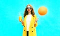 Fashion portrait happy smiling woman holds orange air balloon