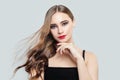 Fashion portrait of perfect young model woman with blowing long brown hair and red lips make up Royalty Free Stock Photo
