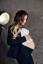 Fashion portrait pregnant woman blonde, perfect figure of girl. Woman is waiting for birth of a baby. Art woman in late pregnancy Royalty Free Stock Photo