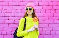 Fashion portrait pretty smiling girl with lollipop over colorful Royalty Free Stock Photo