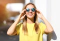 Fashion portrait pretty smiling girl in sunglasses enjoying Royalty Free Stock Photo