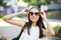 Fashion portrait pretty smiling girl in sunglasses enjoying outdoors in summer. Summer time Royalty Free Stock Photo