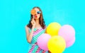 Fashion portrait pretty young woman with an air balloons, lollipop candy Royalty Free Stock Photo