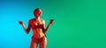 Fashion portrait of seductive girl in stylish swimwear posing on a bright gradient background. Summertime, beach season Royalty Free Stock Photo