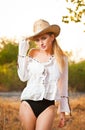 Fashion portrait woman with hat and white shirt in the autumn day Royalty Free Stock Photo