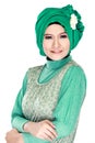 Fashion portrait of young beautiful muslim woman with green cost Royalty Free Stock Photo