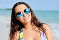 Fashion portrait young brunette girl, having vacation on the tropical island beach Royalty Free Stock Photo