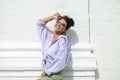 Fashion portrait of young brunette model posing by the wall Royalty Free Stock Photo