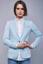 Fashion portrait of young elegant woman in azure man jacket Royalty Free Stock Photo