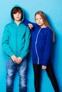 Fashion, portrait and young girl and boy in a studio with a casual, cool and stylish outfit. Youth, friendship and Royalty Free Stock Photo