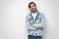 Fashion portrait of young man wearing jeans jacket. Royalty Free Stock Photo