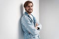 Fashion portrait of young man wearing jeans jacket. Royalty Free Stock Photo