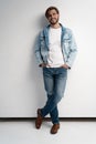 Fashion portrait of young man wearing jeans jacket. Royalty Free Stock Photo