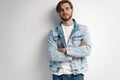 Fashion portrait of young man wearing jeans jacket. Royalty Free Stock Photo