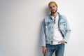 Fashion portrait of young man wearing jeans jacket. Royalty Free Stock Photo