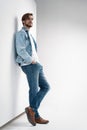 Fashion portrait of young man wearing jeans jacket. Royalty Free Stock Photo