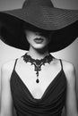 Portrait of young lady with black hat and evening dress Royalty Free Stock Photo