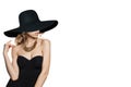 Fashion Portrait of Young Woman in Black Dress and beautiful black wide broad brim hat  on White Background Royalty Free Stock Photo