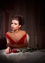 Fashion portrait of young woman with rose flower Royalty Free Stock Photo