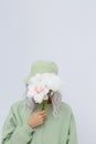 Fashion portrait of young woman wearing trendy bucket hat and cotton hoodie. Aqua menthe monochrome colours. Street style concept Royalty Free Stock Photo