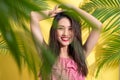 Fashion pretty asian woman posing and smiling over bright summer Royalty Free Stock Photo