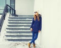 Fashion pretty blonde woman wearing jacket and hat in winter Royalty Free Stock Photo