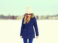 Fashion pretty blonde woman wearing jacket hat in winter day Royalty Free Stock Photo