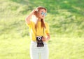 Fashion pretty blonde woman wearing a sunglasses with camera Royalty Free Stock Photo