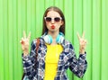 Fashion pretty cool girl wearing a sunglasses and headphones Royalty Free Stock Photo