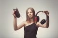 Fashion pretty girl listening music with headphones, speaker, record player, wearing red gloves, and disappointed with bad music. Royalty Free Stock Photo