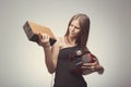 Fashion pretty girl listening music. Looking ugly on radio, with headphones, speaker, record player, wearing red gloves, and Royalty Free Stock Photo