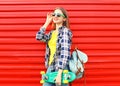 Fashion pretty girl wearing a sunglasses, skateboard Royalty Free Stock Photo