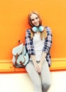 Fashion pretty smiling girl with headphones listens to music Royalty Free Stock Photo