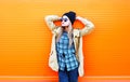 Fashion pretty woman model over orange background Royalty Free Stock Photo