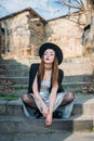 Fashion pretty woman model wearing a balck hat and a black jacket Royalty Free Stock Photo