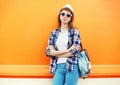 Fashion pretty woman wearing a sunglasses with backpack Royalty Free Stock Photo