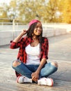 Fashion pretty young african woman having fun in city park Royalty Free Stock Photo