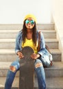 Fashion pretty young african woman with skateboard Royalty Free Stock Photo