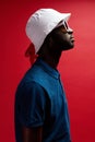 Fashion profile portrait of black man in hat and sunglasses