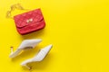 Fashion red bag and shoe woman accessories pastel background. Royalty Free Stock Photo